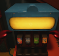 A selection of fountain sodas in the lobby next to the stairs and popcorn machine
